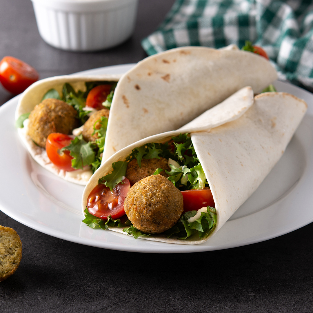 2_0006_tortilla-wrap-with-falafel-vegetables-black-stone-background